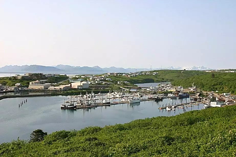 Aerial view of Sand Point harbor and Popof Island on a gray summer day